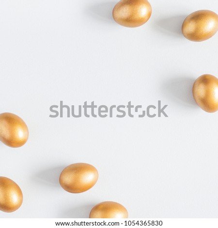 Easter golden eggs on gray background. Easter concept. Flat lay, top view, copy space, square