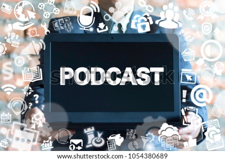 Businessman offers laptop with podcast word on a display. Podcast. Podcasting Business Microphone Audio Broadcast Media Graphic Mobile concept. Royalty-Free Stock Photo #1054380689