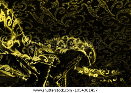 silk cloth Royal monogram. Yellow is dark. This is a black silk velvet with a royal gold seal, creating a negative space patterned picture. Light weight, great for design.