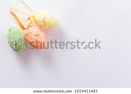 Easter eggs on a stick on a white background