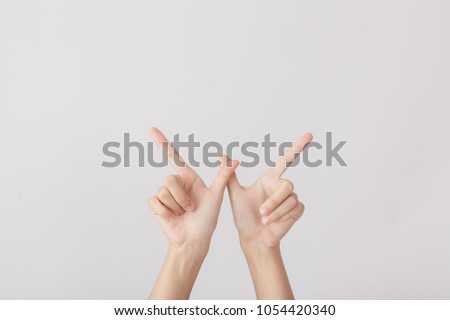Alphabet with hands The Letter W on white background Royalty-Free Stock Photo #1054420340
