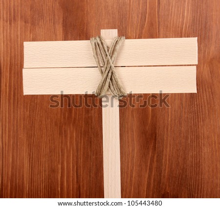 Wooden signboard on wooden background