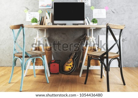 Hipster interior with workplace and empty computer, other items and guitar. Mock up