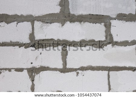 House wall textued background from autoclaved aerated concrete blocks.