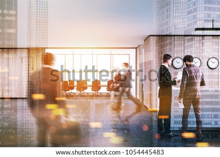 White and wooden conference room interior with a long table, black office chairs and a panoramic window. Business people walking. 3d rendering mock up toned image double exposure blurred