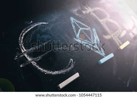 
Currency of euro and crypto currency bitcoin, Ethereum .drawing on a chalkboard