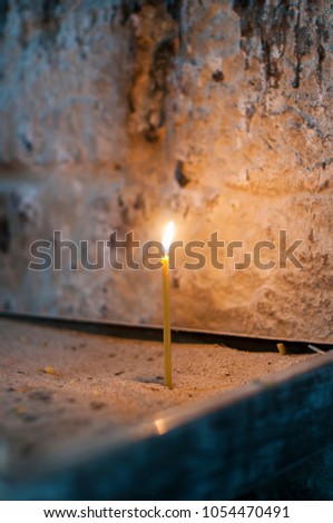 Light candles on the sand