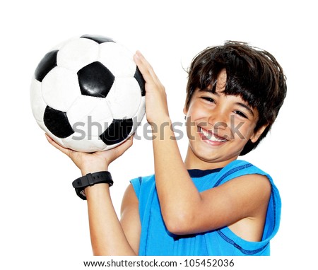 Cute boy playing football, happy child, young male teen goalkeeper enjoying sport game, holding ball, isolated portrait of a preteen smiling and having fun, kids activities, little footballer Royalty-Free Stock Photo #105452036