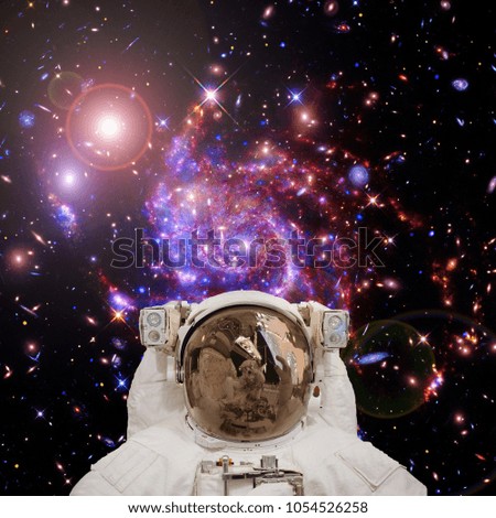 Colorful nebula and stars. Astronaut posing. The elements of this image furnished by NASA.