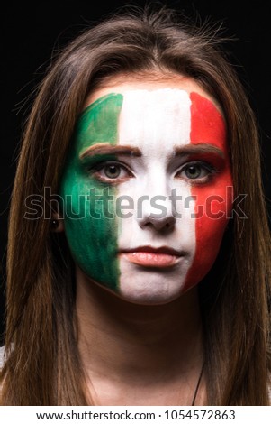 Portrait of woman face supporter fan of Mexico national team with painted flag face isolated on black background.