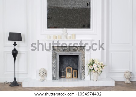 an elegant room of a rich house with a white fireplace with artificial flowers and a mirror, a background picture for decoration