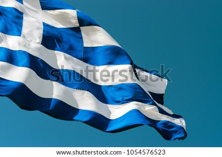 Flag of Greece against the blue sky background