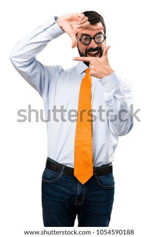 Funny man with glasses focusing with his fingers