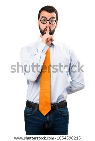 Funny man with glasses making silence gesture