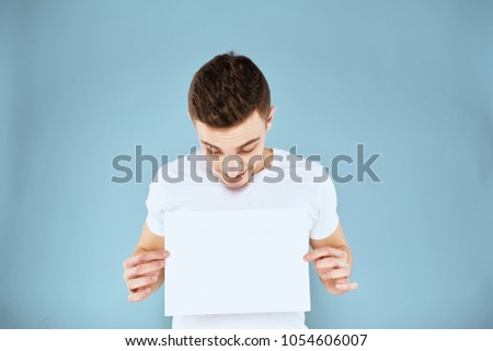 man with a sheet of paper
