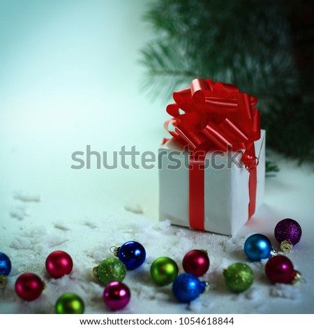 white box with gift on Christmas background.