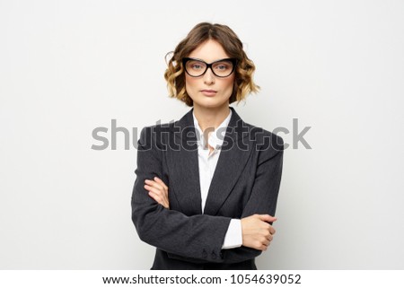  serious business woman in suit, office                              