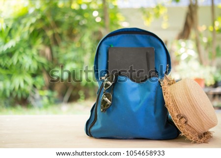 Backpack with travel Royalty-Free Stock Photo #1054658933