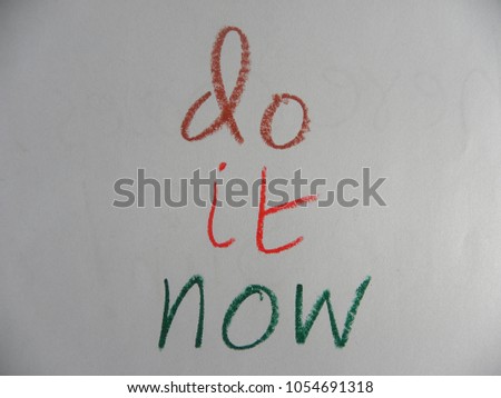 Inspirational quote do it now hand written by colorful oil pastels on paper