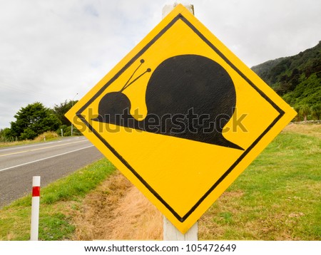Fake New Zealand Road Sign, Attention Kauri Snail Crossing set up a rural country road