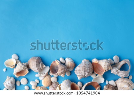 Sea vacation frame with shell on blue