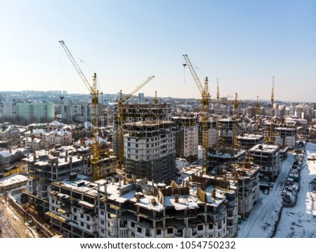 construction of a residential complex, air filming, background image on a winter day