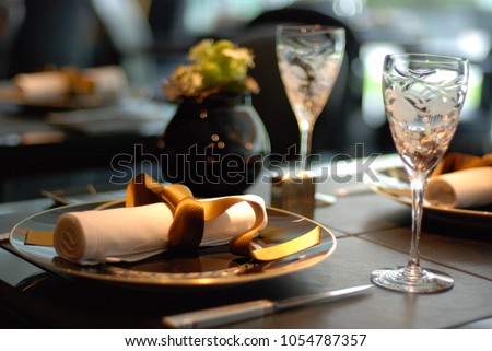 A very elegant and beautiful table setting at fine dinning restaurant. Royalty-Free Stock Photo #1054787357