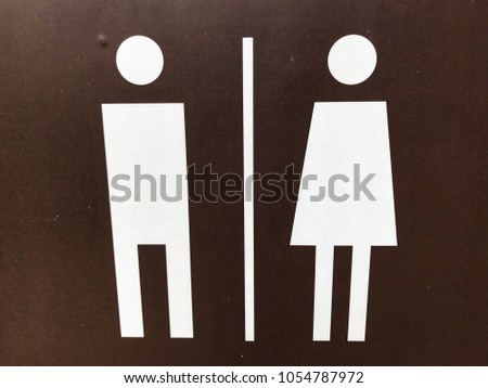 Sign of man and women on wall background