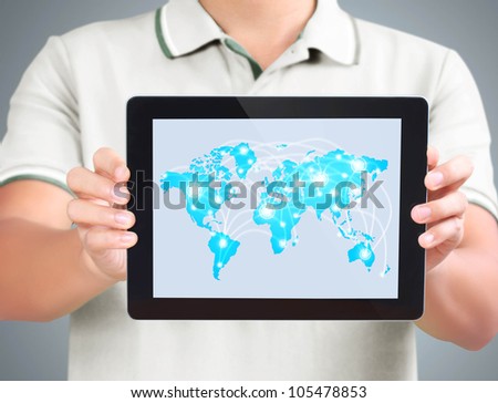 Business man holding and shows tablet