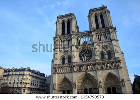 Notre Dame De Paris on sunny day blue sky