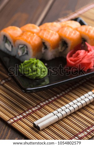 Sushi roll set, California rolls and sticks, selective focus, vertical image