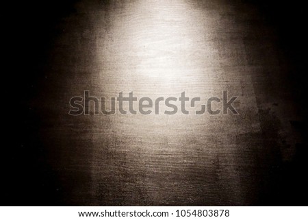 Black wood texture with light for backgrund.