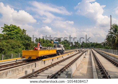 Truck car can running on road and railway for transportation tools and equipment for construction which running on track of sky train viaduct.