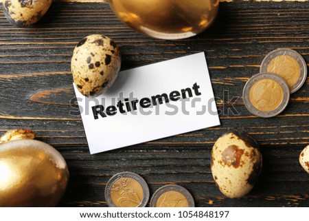 Eggs, coins and sign RETIREMENT on wooden background. Pension planning