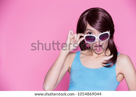 woman wear sunglasses and feel surprise on the pink background