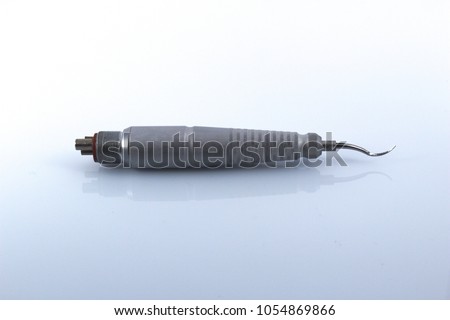 Periodontal air scaler used for dental treatment and prophylactic Royalty-Free Stock Photo #1054869866