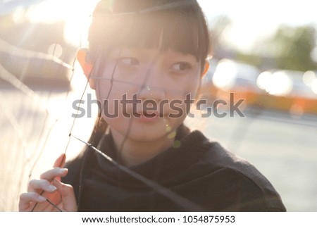 Young pretty girl wearing black cotton sweatshirt outdoor backgound