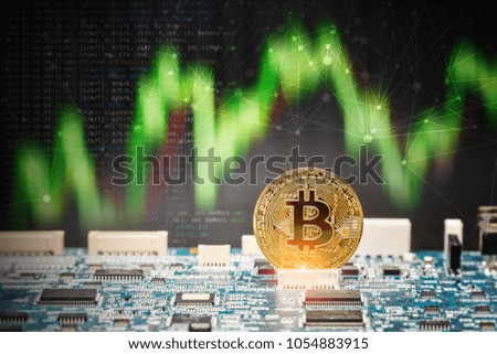 Golden bitcoins standing on circuit board,Business concept.