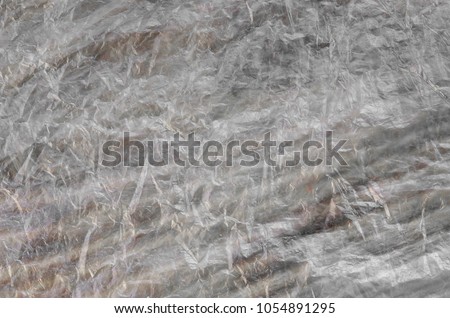 Texture of cellophane material with many folds and bends