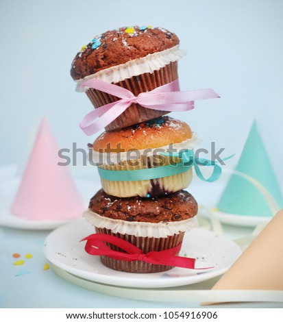 Three Muffins on top of Each Other Tied with Ribbons. Party Concept. cones. Square Image