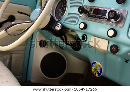 wheel car of mid-20th century. Interior of old car (car salon) with radio and control keys. Soviet government car GAZ-13 Chaika, Executive passenger vehicle