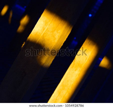 Beautiful sunlight fallen on the pillars of a construction site unique stock photo