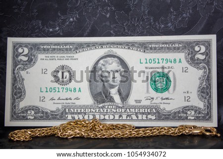 Jewelry golden and money on the black background. banknote dollar. concept of pawnshop. 