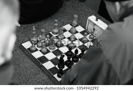 on the street playing chess
