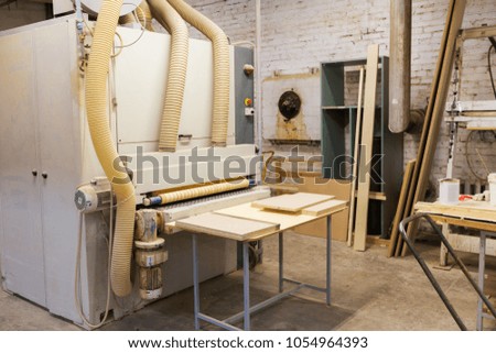 production, manufacture and woodworking industry concept - furniture factory workshop