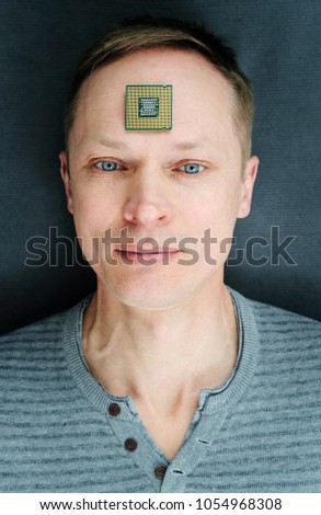 The man wiht a CPU. The processor is on the man's forehead.