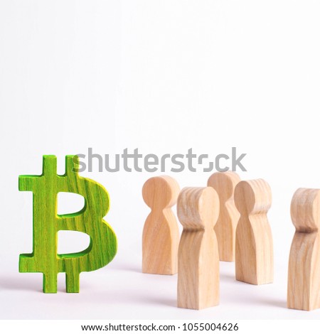 Wooden figures of people are standing near a bitcoin on a white background. Crypto currency, blockchain technology. The collapse and rise cost of bitcoin. Mining farms, miners, stock exchange crypts