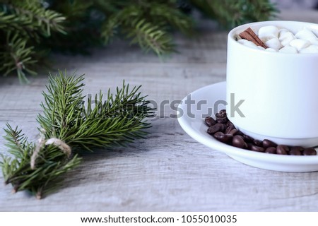 Coffee with marshmallows at the Christmas tree. 