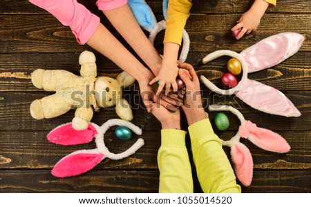 Bunny ears, easter egg, easter rabbit - easter day concept for happy family. Easter family with fake bunny ears