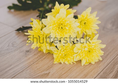 Yellow flowers on floor